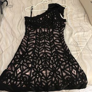 Black crochet lace with pink underlining.